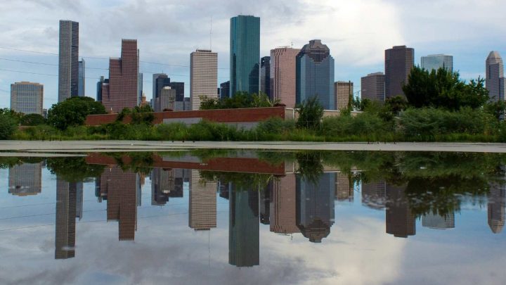 lake in front of the Houston skyline
