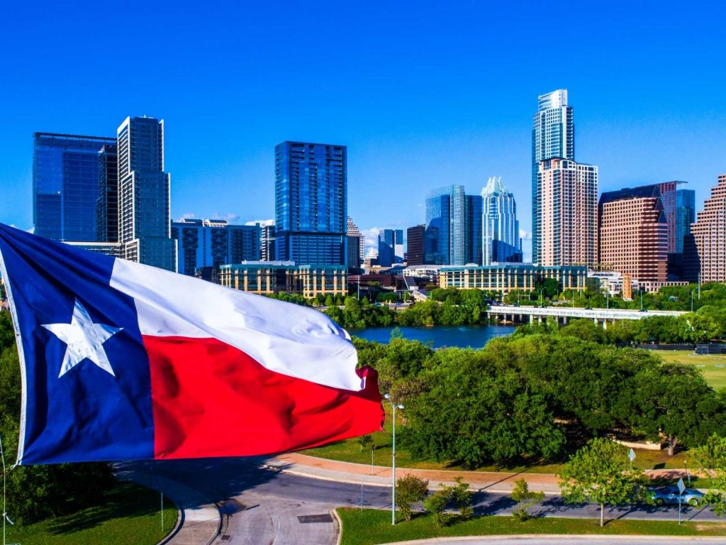 Austin skyline with Texas flag in the forefront