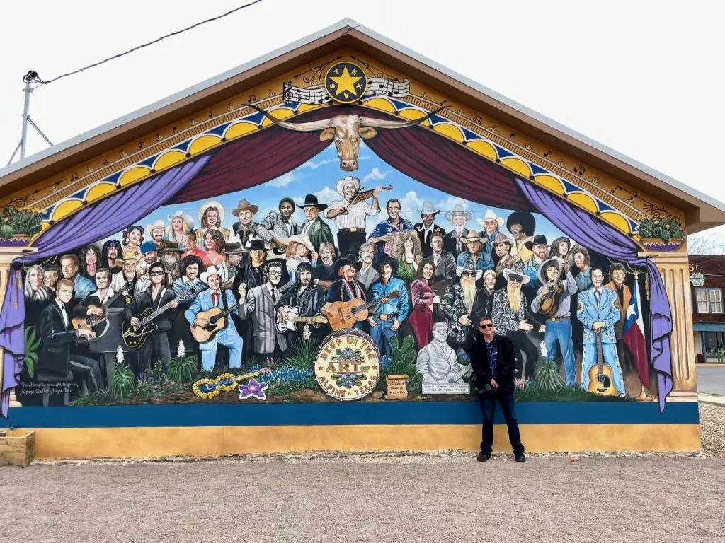 Marty in front of one of the many murals in Alpine, TX