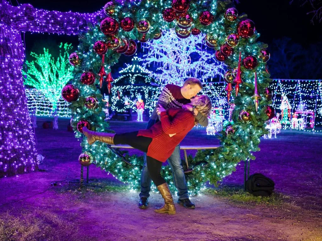 Marty and Michelle kissing at a Dallas Christmas display